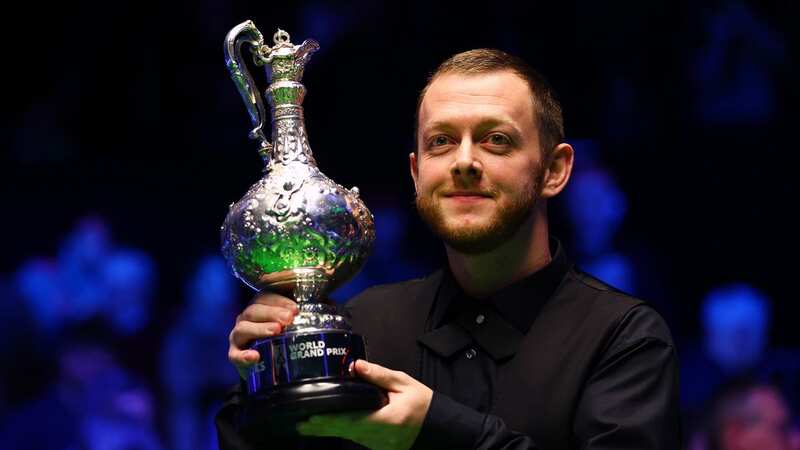Mark Allen lifts the 2023 World Grand Prix trophy (Image: Getty Images)