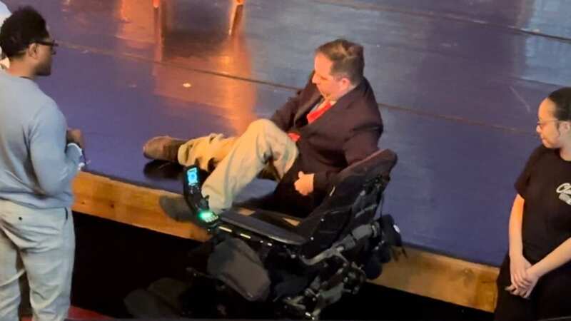 Chris Hinds had to pull himself out of his wheelchair (Image: twitter.com/VinnieChant)