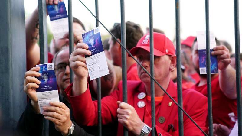 Liverpool fans stuck outside the ground show their match tickets during the UEFA Champions League Final at the Stade de France, Paris (Image: PA)