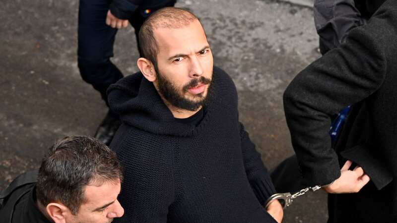 Andrew Tate remains detained in a Romanian prison (Image: AFP via Getty Images)