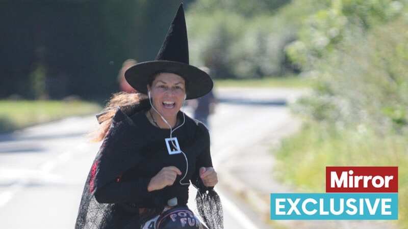 Judy Scrine taking part in The Reigate Half Marathon dressed as a witch (Image: Judy Scrine)