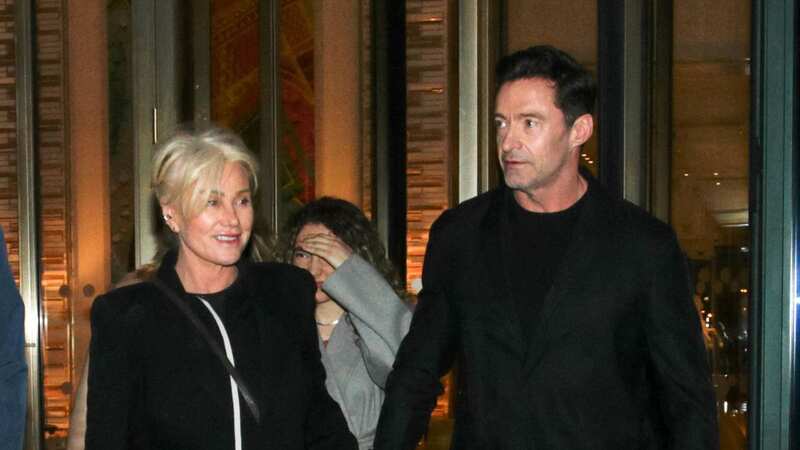 Hugh Jackman and wife Deborra-Lee hold hands as they enjoy night out in Paris (Image: Spread Pictures / MEGA)