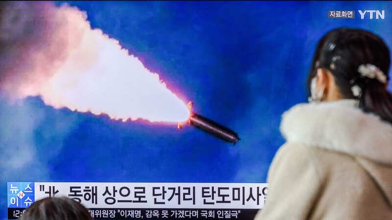 In Seoul, a TV screen shows North Korea