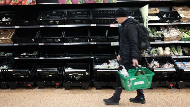 Empty fruit and vegetable shelves at an Asda in East London (Image: PA)
