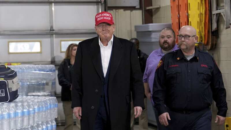 Trump promotes his brand of bottled water in visit to train derailment disaster