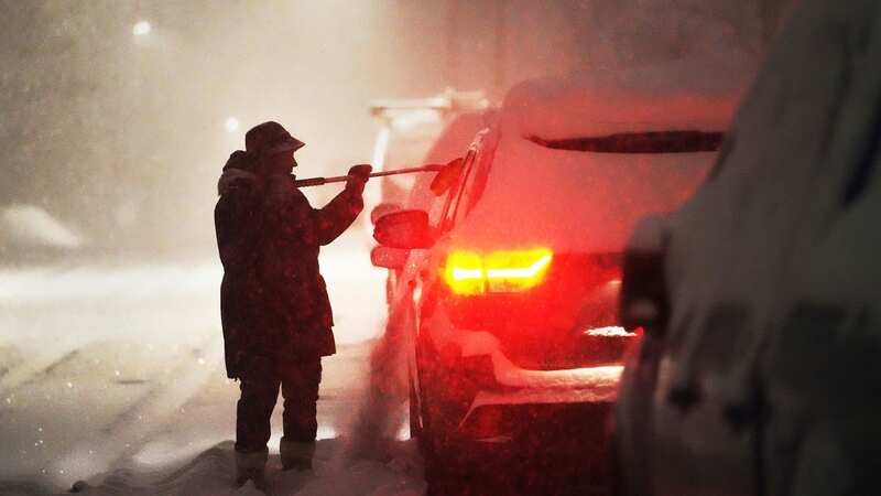 People trapped in their cards because of a snowstorm in Minneapolis, Minnesota (Image: AP)