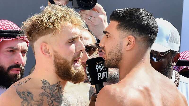 Jake Paul and Tommy Fury held apart during heated face-off at weigh-in