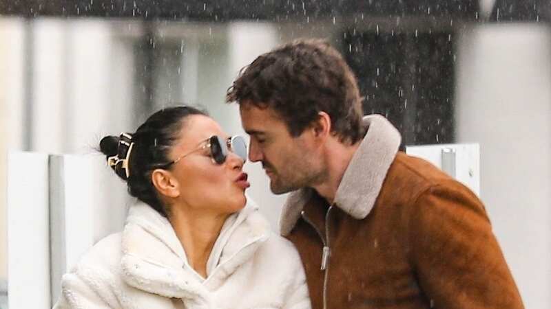 Nicole Scherzinger squashes split rumour with Thom Evans as they pucker up in LA