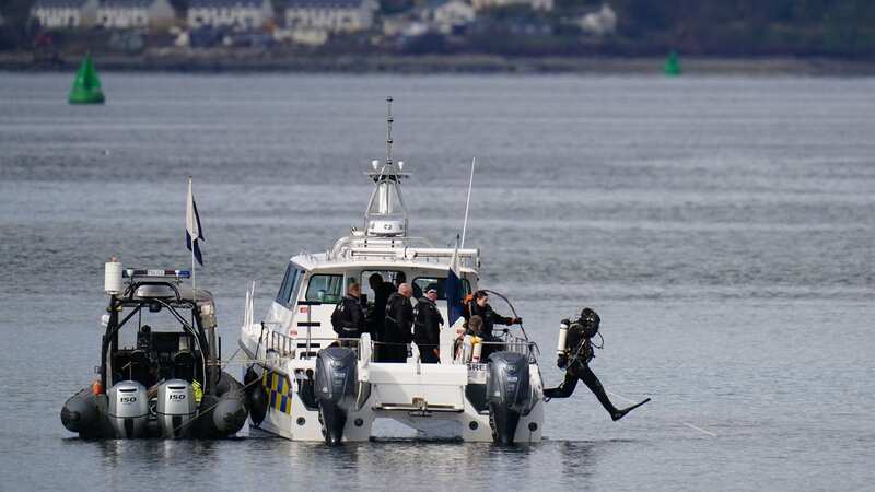 Police boats and divers taking part in the rescue operation in the Firth of Clyde near Greenock (Image: PA)