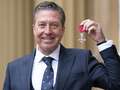 John Torode beams with joy as he receives MBE from Prince William