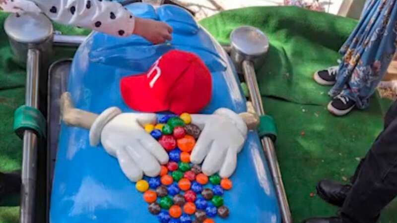 Teacher buried in M&M-themed casket for funeral in tribute to ex-pupils