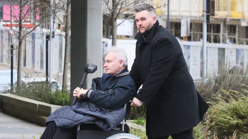 Eamonn Holmes is pushed in a wheelchair (Image: JAMES CURLEY AND MAGICMOMENTSUK)
