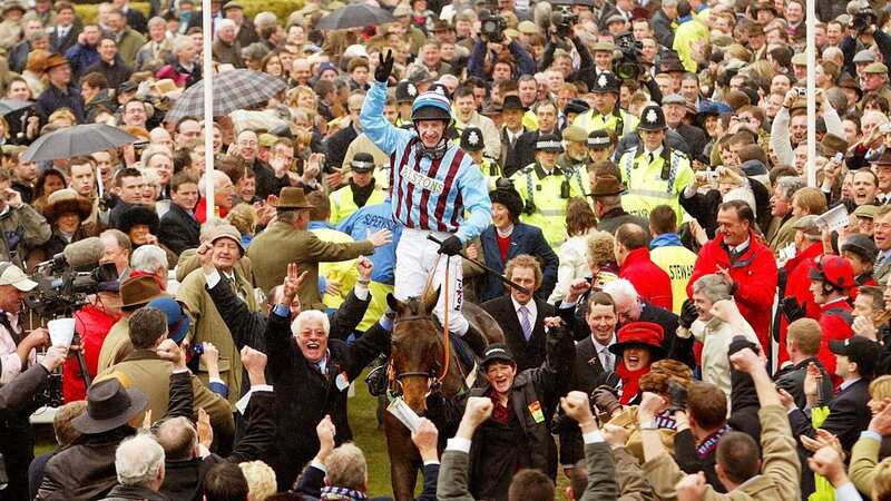 Joyous scenes: Jim Lewis (hands aloft) salutes the crowd after Best Mate wins a third Cheltenham Gold Cup (Image: Unknown)