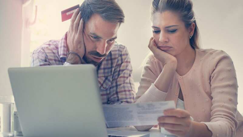 Couple having problem with bills and money (Image: Getty Images/iStockphoto)