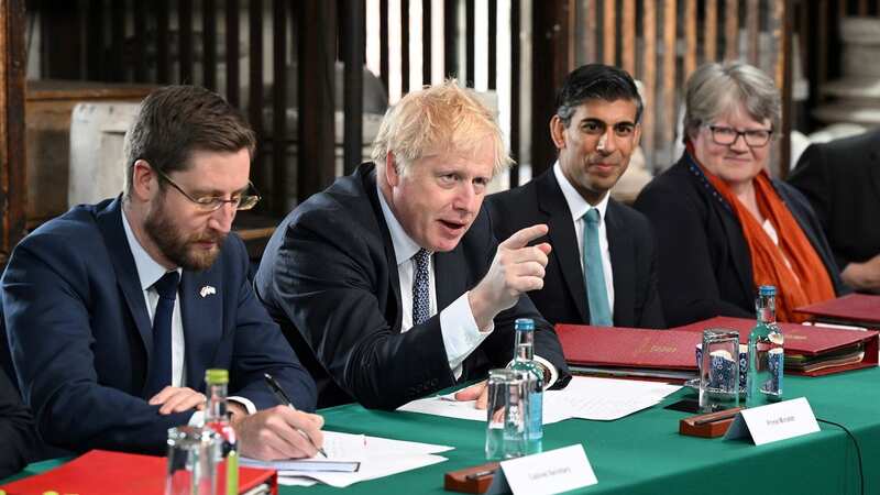 Civil service boss Simon Case (left), with Boris Johnson and Rishi Sunak (Image: Getty Images)