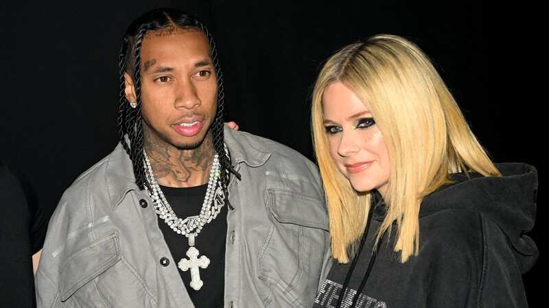 Avril Lavigne and Tyga appeared to confirm their romance during an event in Paris on Monday (Image: Corbis via Getty Images)