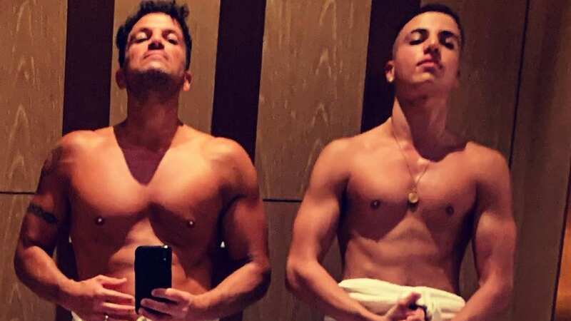 Peter and Junior Andre show off matching 6 packs in topless photo on singer
