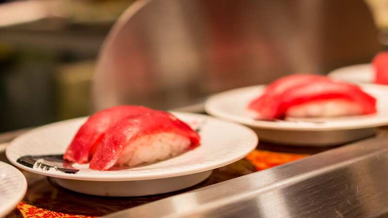 Some restaurants have decided to stop operating the sushi conveyor belts (Image: Getty Images)