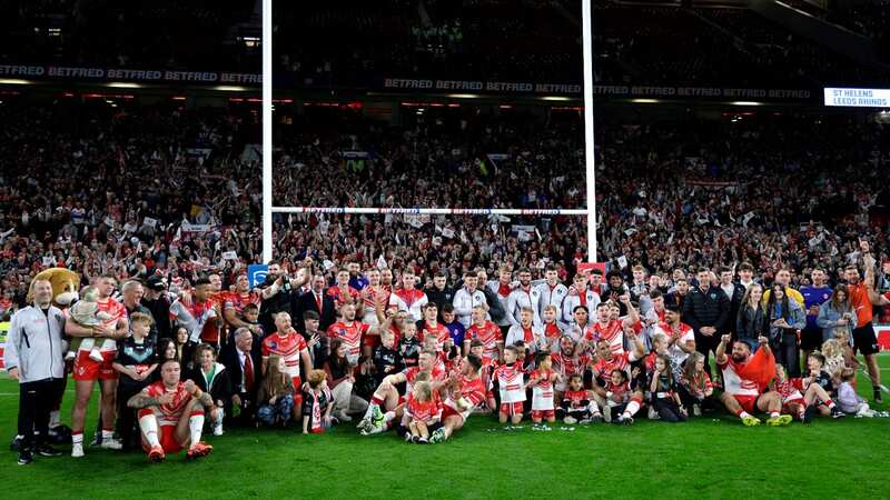 St Helens players and staff celebrate with the trophy after victory in the Betfred Super League Grand Final at Old Trafford (Richard Sellers/PA Wire) (Image: PA)