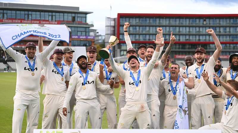 MANCHESTER, ENGLAND - SEPTEMBER 28: Surrey captain Rory Burns (with trophy) leads the celebrations after Surrey win the First Division Title after the third day of the LV= Insurance County Championship match between Lancashire and Surrey at Emirates Old Trafford on September 28, 2022 in Manchester, England. (Photo by Stu Forster/Getty Images)