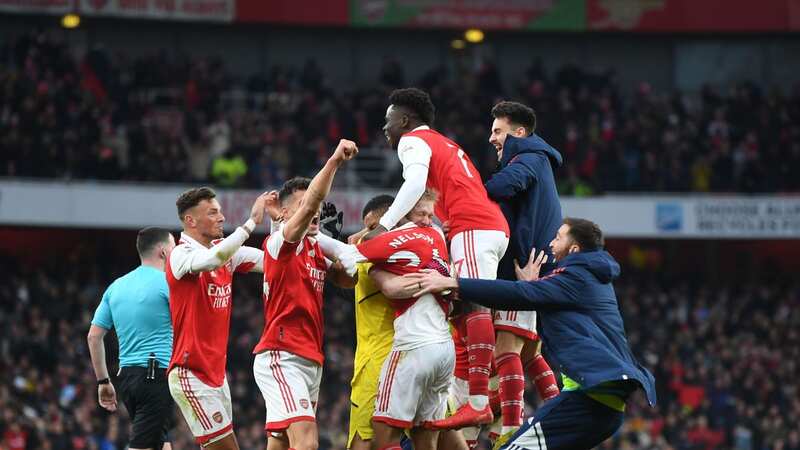 Arsenal players and staff celebrate their last-minute winner against Bournemouth (Image: Getty Images)