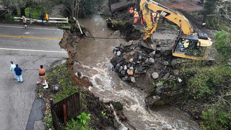 Emergency repairs to a road that was washed out by heavy rains in Soquel, California (Image: Getty Images)