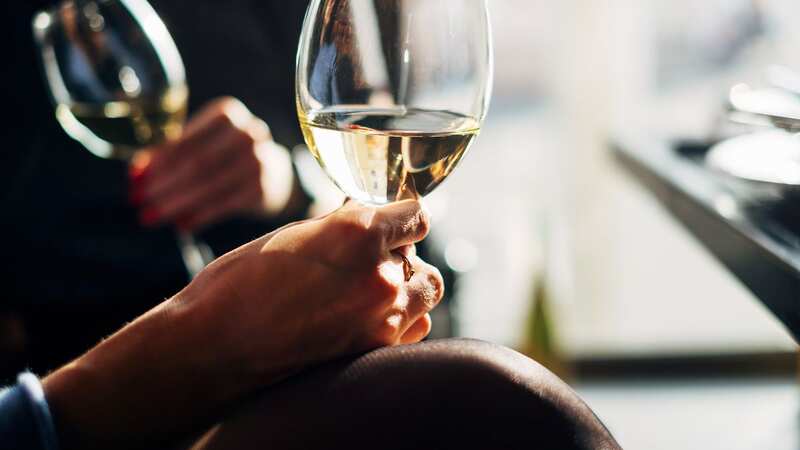 There is a theory white wine contains extra elements over red varieties that contribute to mood swings (Image: Getty Images/RooM RF)
