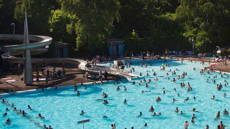 People swim in a public swimming pool in Berlin