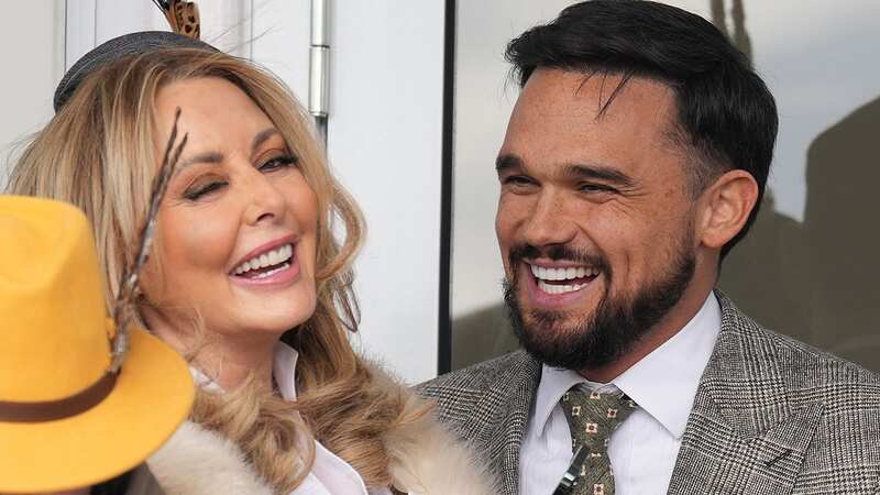Carol Vorderman and Gareth Gates get very cosy at Cheltenham