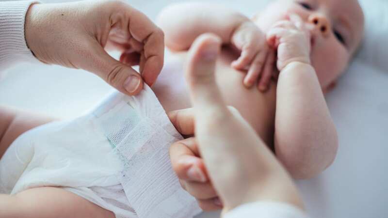 The mum had changed the nappy on a table next to him (stock image) (Image: Getty Images)