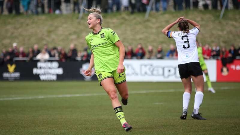 Alessia Russo celebrates after Manchester United take the lead against Lewes at the Dripping Pan