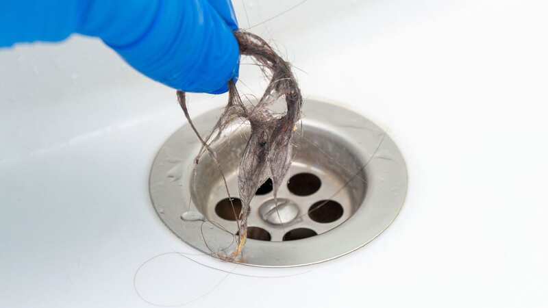 Bathroom drains can easily end up getting clogged up with hair (Image: Getty Images/iStockphoto)