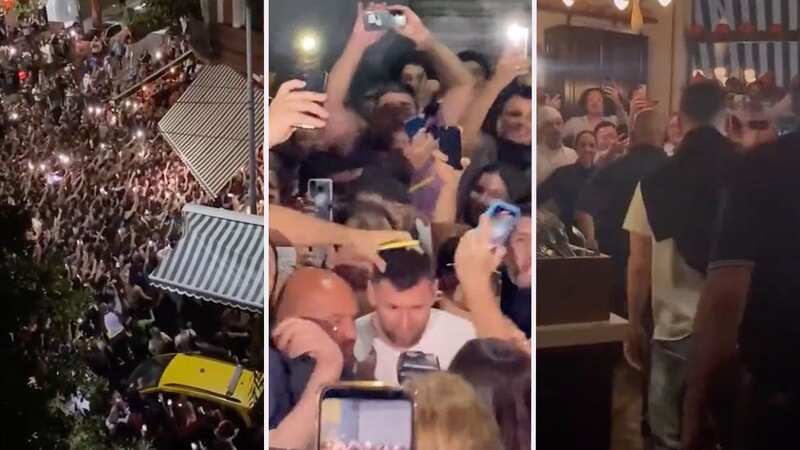 Lionel Messi, wearing the white t-shirt, is seen walking through the restaurant (Image: @porquetendencia)
