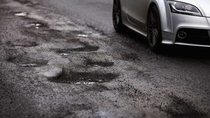 Potholes will cost more than £14bn to repair, according to a new survey (Image: Getty Images)