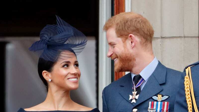 Harry and Meghan on the balcony of Buckingham Palace during the 2018 centenary of the Royal Air Force (Image: Getty Images)