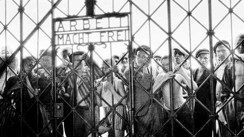 Inmates at the gates of Dachau as it is liberated in 1945 (Image: Gamma-Keystone via Getty Images)