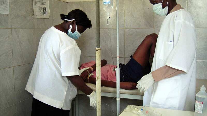 Angolan health workers treat a woman in April 2005 of Marburg virus (Image: AFP via Getty Images)