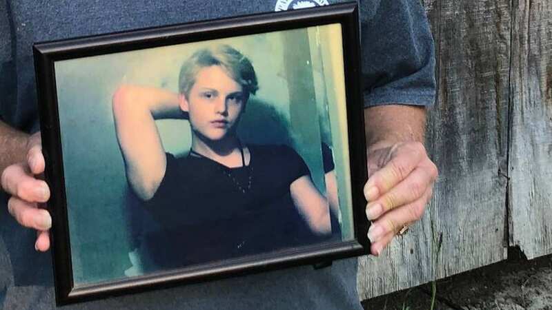Sandy Smith holds a photo of her late son, 19-year-old Stephen Smith (Image: Zuma Press/PA Images)