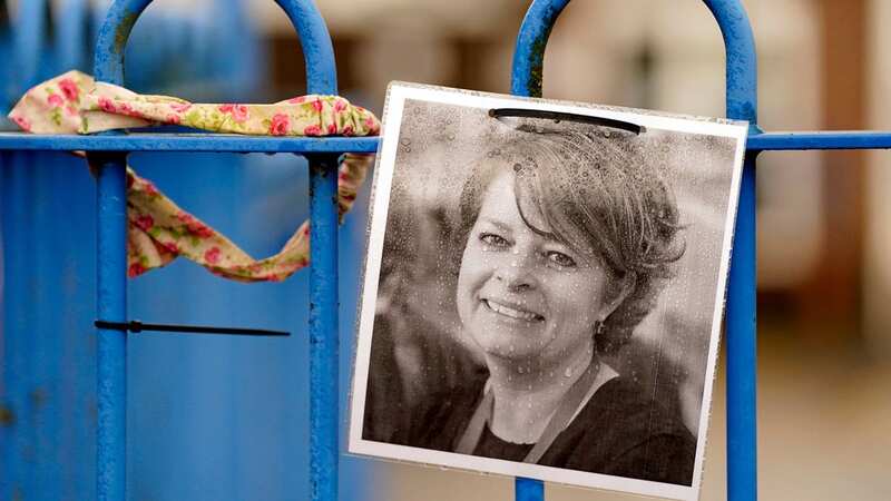 A photograph of Ruth Perry attached to the fence outside John Rankin School in Newbury (Image: PA)