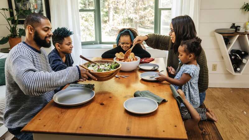 Families only manage to sit down for a meal together on four days out of seven each week (Image: The Good Brigade/Getty Images)
