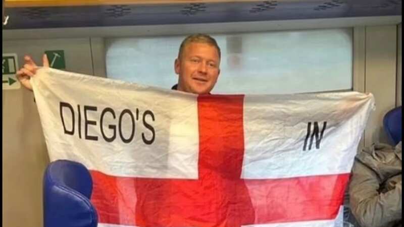 Jake Hepple with flag that got him barred from Italy match (Image: Twitter)