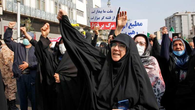 Hijab-clad Iranian women rally in a protest against the Mahsa Amini demonstrations in Iran (Image: AFP via Getty Images)