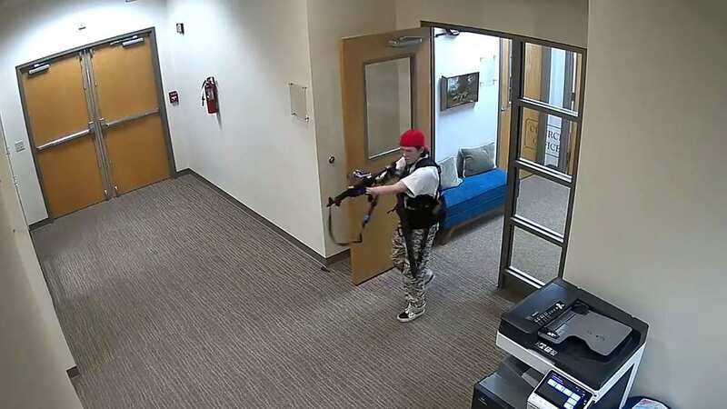 Shooter Audrey Hale inside the school building, armed with an assault rifle (Image: Metropolitan Nashville Police De)