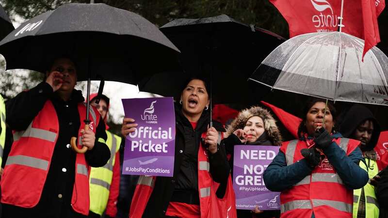 Security guard members of the Unite union on the picket line at Heathrow Airport (Image: PA)