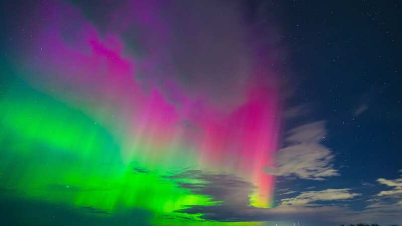 The Northern Lights could be visible in parts of the UK tonight (Image: John Trueman/SWNS)