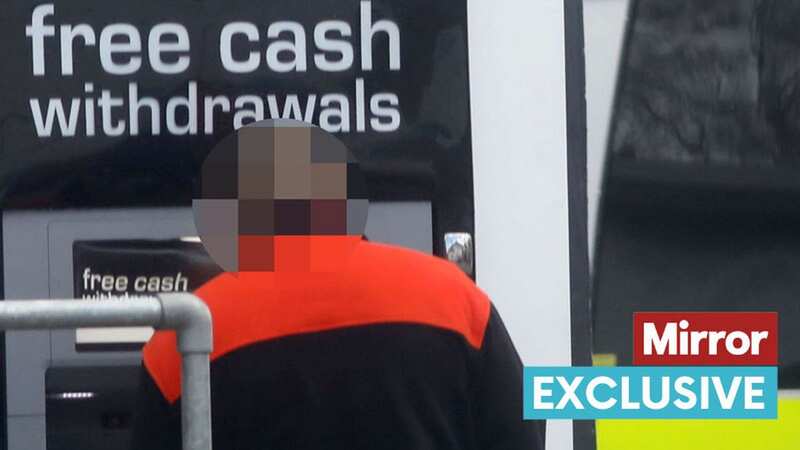 A prisoner withdraws cash from an ATM (Image: NB PRESS LTD)