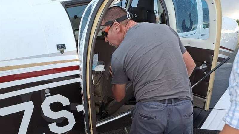 Snake catcher, Johan de Klerk looking for the highly venomous Cape cobra in the Beechcraft that had to make an emergency landing at the Welkom airport on Monday (Image: news24)