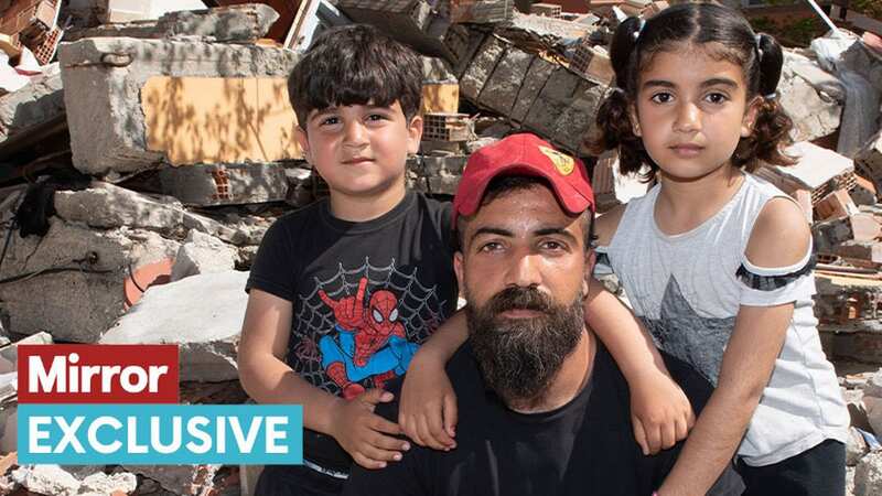 Ahmed Cummal with the twin daughters rescued through small hole in the rubble their house (Image: Andy Stenning/Daily Mirror)