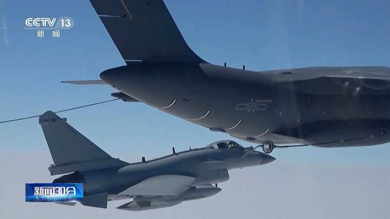 A Chinese fighter jet performs an mid-air refuelling manoeuvre (Image: AP)