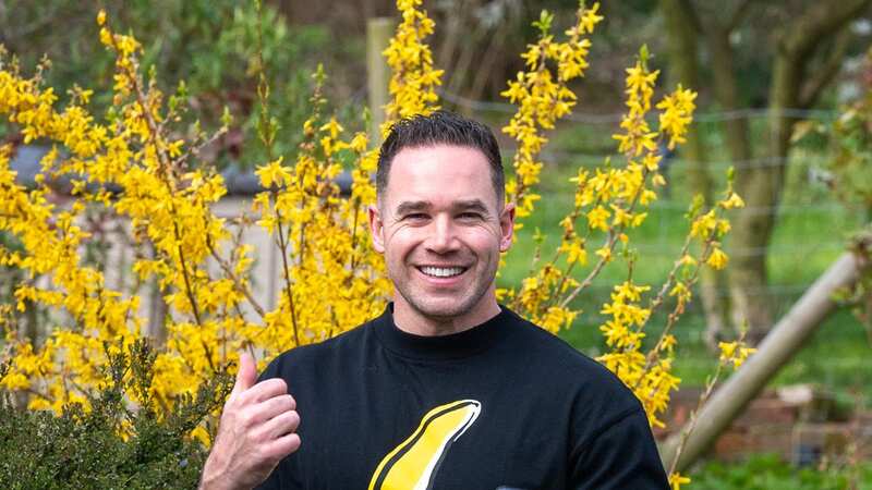 Kieran Hayler gives a thumbs up to photographers after his arrest (Image: CLICK NEWS AND MEDIA)